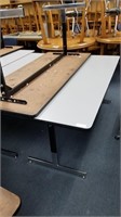 3 adjustable white tables