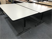 2 White adjustable tables