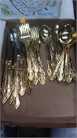 Gold tone flatware set.  Stainless steel