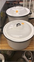 Enamel ware pots with lids.