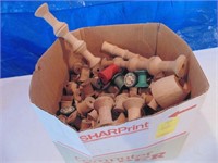 box of wooden thread spools