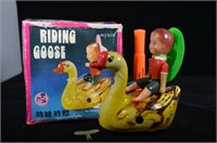 VINTAGE TIN WIND UP TOY- CHILD RIDING A GOOSE