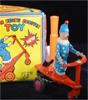 VINTAGE TIN WIND UP TOY - CLOWN RIDING A SCOOTER