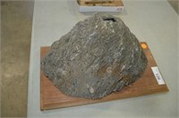 LAVA ROCK MOUNTED ON BOARD- HAS A SLOT FOR A KNIFE