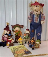 Box of fall decor scarecrows and flag