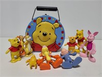 Winnie the Pooh tin and 9 character toys