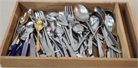 Wooden box of stainless steel flatware