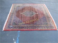 ORIENTAL RUG WITH DOUBLE MEDALLION CENTER: