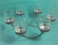 Metal candle holder holds 6 tealight candles