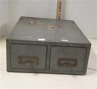 Small metal file cabinet.