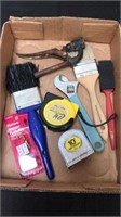 Group of paint brushes tape measures