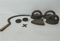 4 cast iron irons, hay cutter & 2 cast iron pieces