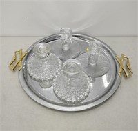 silver coloured serving dish and 4 candle holders