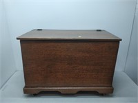 wooden chest on wheels and bottle capper
