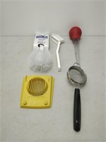 lot of kitchen tools- spoons, whisks, baster, etc.