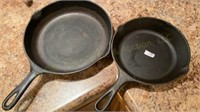 Two Cast Iron Skillets One is a Lodge