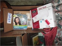 box with hair dryer, rollers and other items