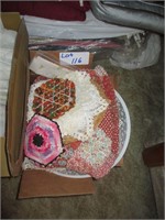 small box of towels and lace items