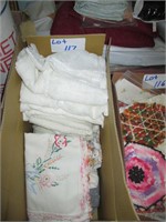 box of lace items and embroidered items
