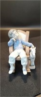 Lladro Figurine 
ALL TUCKERED OUT BOY IN ROCKING