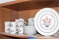 Contents of shelf, cups and saucers