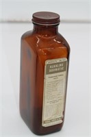 Antique bottle with alkaline aromatic label