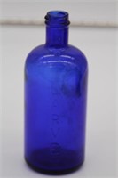 Antique blue bottle labeled "larvex"