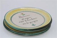 Lot of four ceramic plates with French sayings