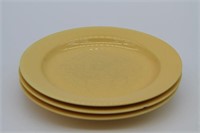Lot of three yellow ceramic plates