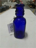 Baby face blue glass milk bottle