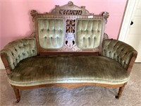 Walnut Victorian Eastlake settee with carved