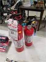 Three charged fire extinguishers