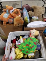 Three boxes of stuffed animals and pillows