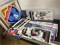 Lot of Disney license plates & signs.