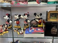 Lot of Disney bobble heads, clock, figures.