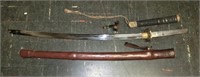 Japanese sword with leather wrapped scabbord