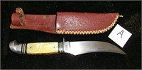 A- Western Boulder Colo. curved blade knife with