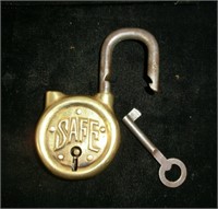 lg. brass "SAFE" round padlock with key in