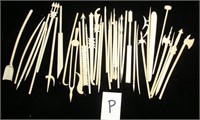 36 carved bone picks some in the shape of tools,