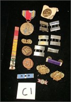 17 pieces of U.S. military insignia, bars, m