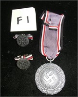 WWII German 1938 Swastika medal with ribbon and 2