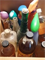 Box of cleaner and old bottles
