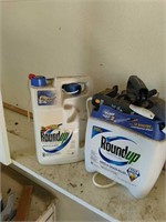 Two partial jugs of Roundup