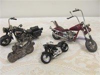Group of 4 small model motorcycles