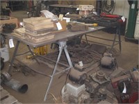 4" X 8' STEEL TABLE ON STEEL SAW HORSES