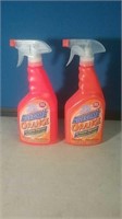 Two partial bottles of awesome orange a