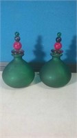 Pair of green glass perfume bottles with red and