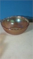 Orange carnival glass bowl with scalloped rim