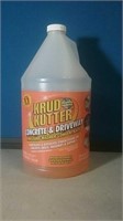 Partial gallon jug of crud cutter concrete and