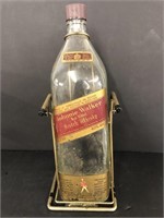 Vintage Johnnie Walker Whiskey bottle with stand